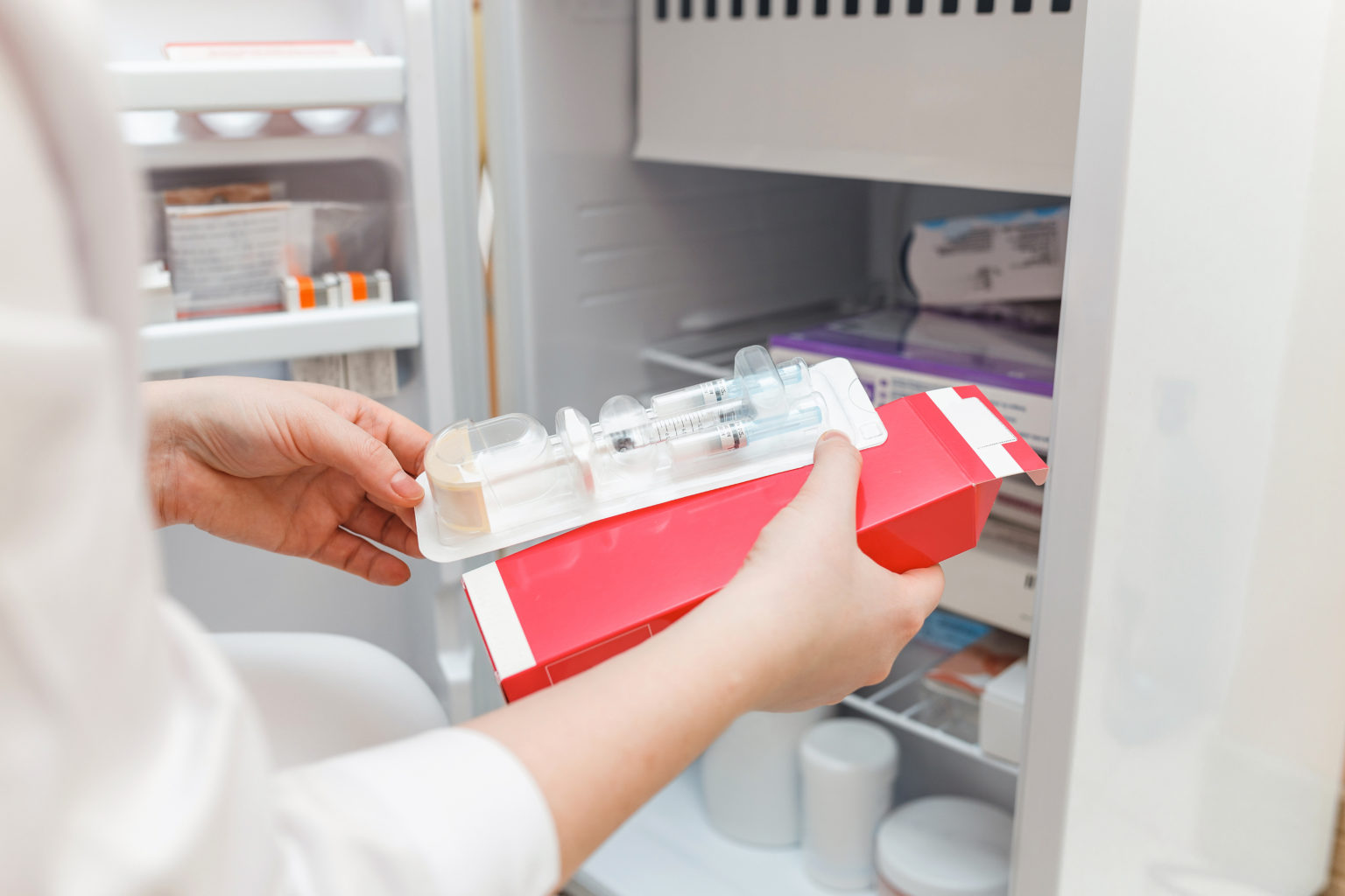 Disposable syringe being taken out