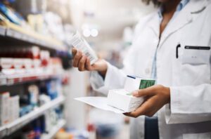 Cropped shot of an unrecognizable young female pharmacist working in a pharmacy.